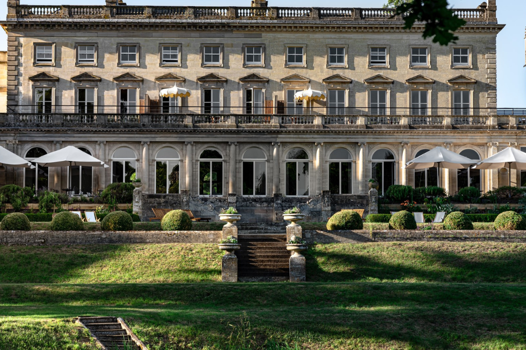 Exterior of Cowley Manor in Cheltenham, ideal for luxury stays and Cheltenham airport transfers.