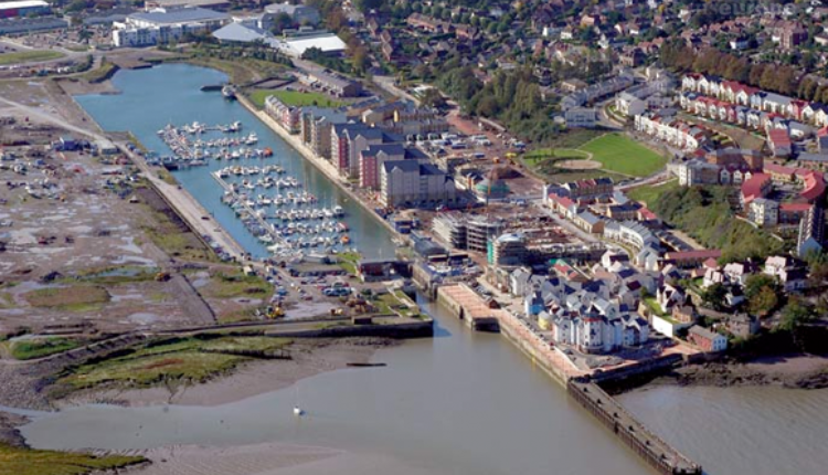 Aerial view of Portishead Marina with boats, waterfront apartments, and the estuary in Somerset
