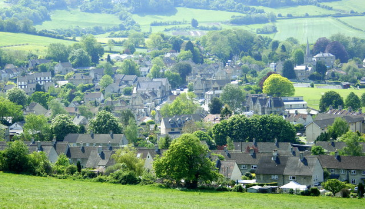 Aerial view of the village of Box in Wiltshire surrounded by rolling green countryside