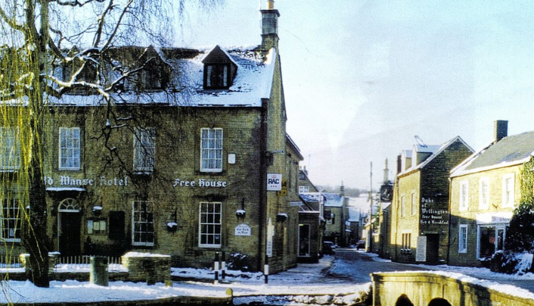 The Old Manse Hotel in Bourton-on-the-Water with traditional stone buildings beside the River Windrush