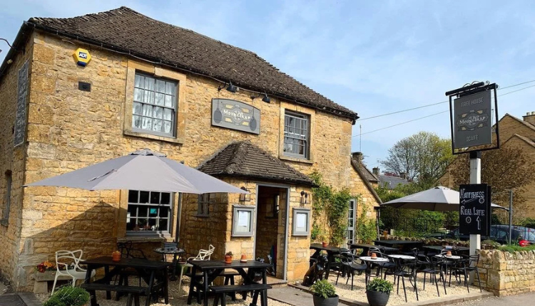 The Mousetrap Inn in Bourton-on-the-Water with traditional Cotswold stone building and outdoor seating