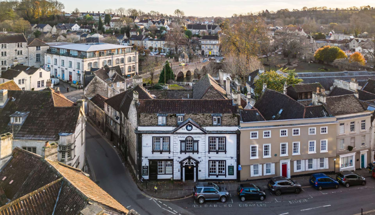 Aerial view of The Swan Hotel surrounded by historic buildings in Bradford-on-Avon, Wiltshire