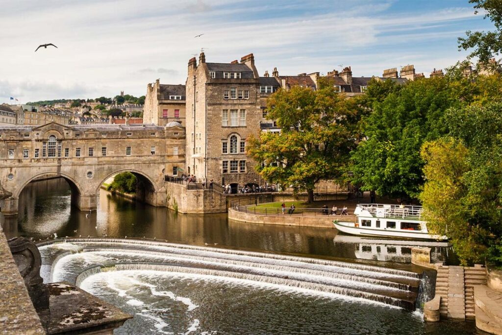 River Avon flowing past the historic bridge and weir in Bradford-on-Avon, Wiltshire