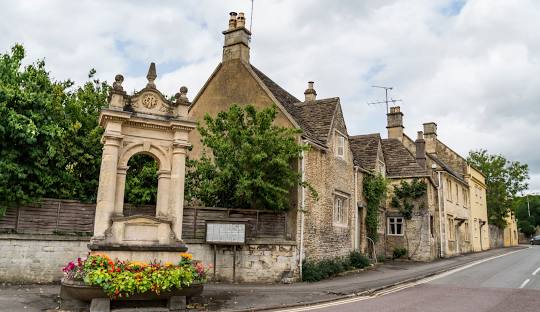 Historic stone buildings and monument in Corsham – Xverso Chauffeur Services in UK