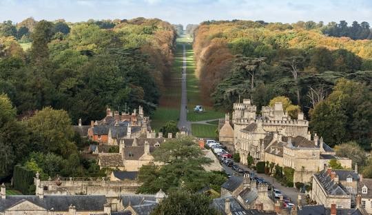 Aerial view of Cirencester town and surrounding parkland