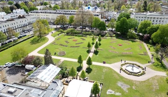 Aerial view of Cheltenham gardens and Regency buildings, ideal for Cheltenham airport transfers and chauffeur services.