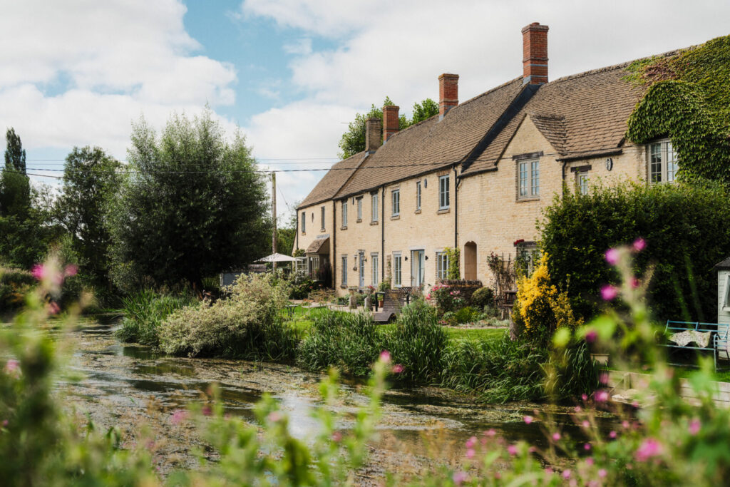 Riverside cottages in Fairford beside the River Coln.