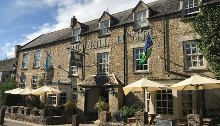 Aerial view of Kempsford village showing residential streets, green spaces, and surrounding countryside.