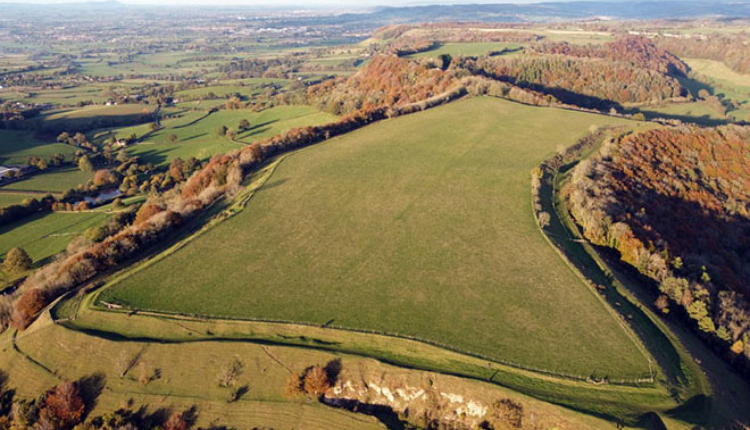Aerial view of Uleybury Hill Fort near Uley, showing the Iron Age earthworks and surrounding countryside.