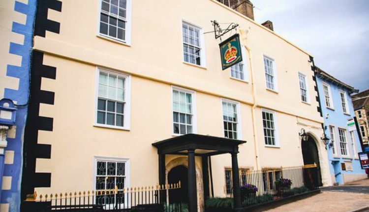 The Old Crown Coaching Inn in Faringdon, a traditional Georgian coaching inn with a pale façade on a historic street.
