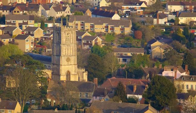 Aerial view of Wotton-under-Edge with St Mary’s Church rising above surrounding houses.